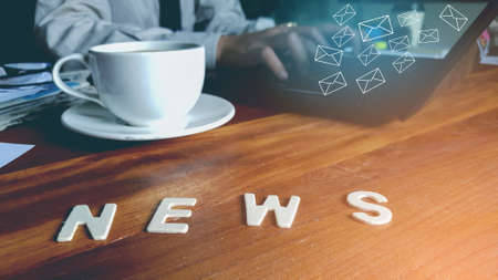 Newsletter concept hand of businessman checking message box on digital laptop vintage tone filter Stock Photo