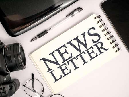 News maker concept top view flat layout photographer press journalist working desk dslr camera with smart phone notebook laptop and eyeglasses