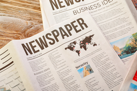 Newspapers on table Stock Photo
