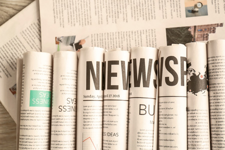 Many newspapers on table top view