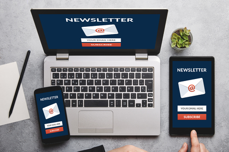 Subscribe newsletter concept on laptop tablet and smartphone screen over gray table all screen content is designed by me flat lay Stock Photo