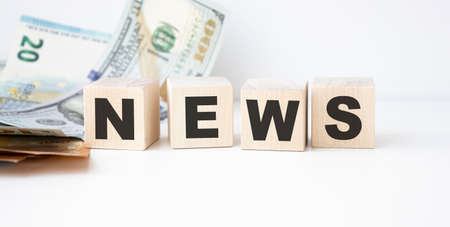 Wooden news sign on a table in an office