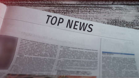 Top news headline of a printed newspaper close up