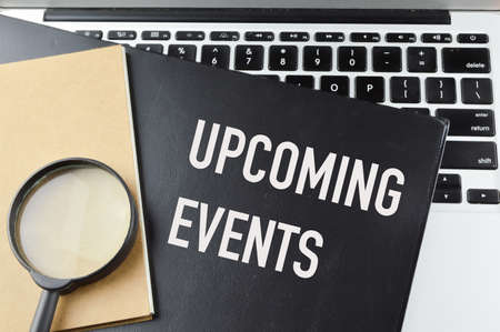Top view of black file written with upcoming events Stock Photo