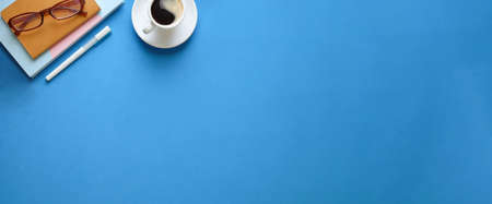 Top view office stuff with notepad laptop and coffee cup mouse notepad shot blank screen mobile phone and supplies on white desk workspace and copy space