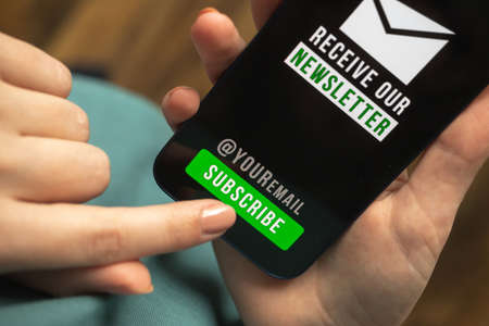 Email marketing and newsletter concept hand of woman press subscribe button to join the newsletter register a new member concept