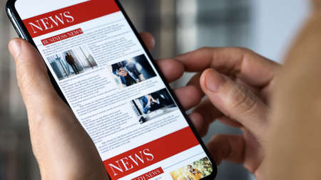 Reading news on mobile phone