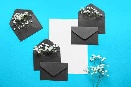 Blank card with envelopes and flowers on blue background