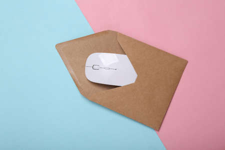 Envelope with pc mouse on blue pink pastel background email