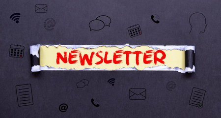 Newsletter word written on wood block newsletter text on table