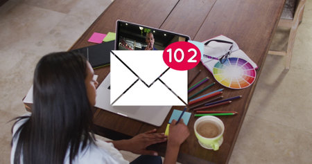 Image of email icon with numbers over caucasian woman on laptop image call global social media business technology data processing and digital interface concept digitally generated image Stock Photo