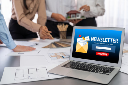 Group of interior architect designer discussing together on blueprint and laptop screen display architecture software for more precise designing layout modern home design and renovation insight