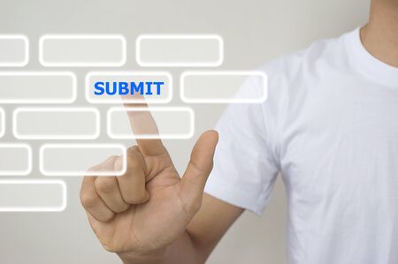 A man using digital interface with his fingers submit buttons Stock Photo