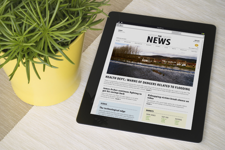 News tablet all screen graphics are made up Stock Photo